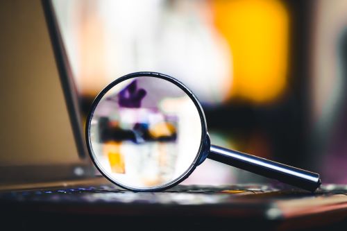 magnifying glass on laptop