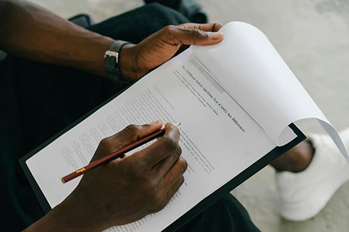 man filling out questionnaire