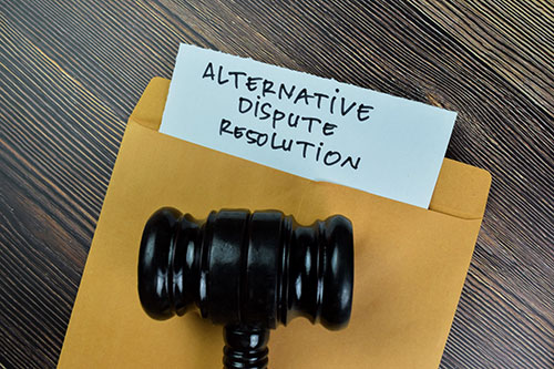 Gavel on envelope with "Alternative Dispute Resolution" written on it